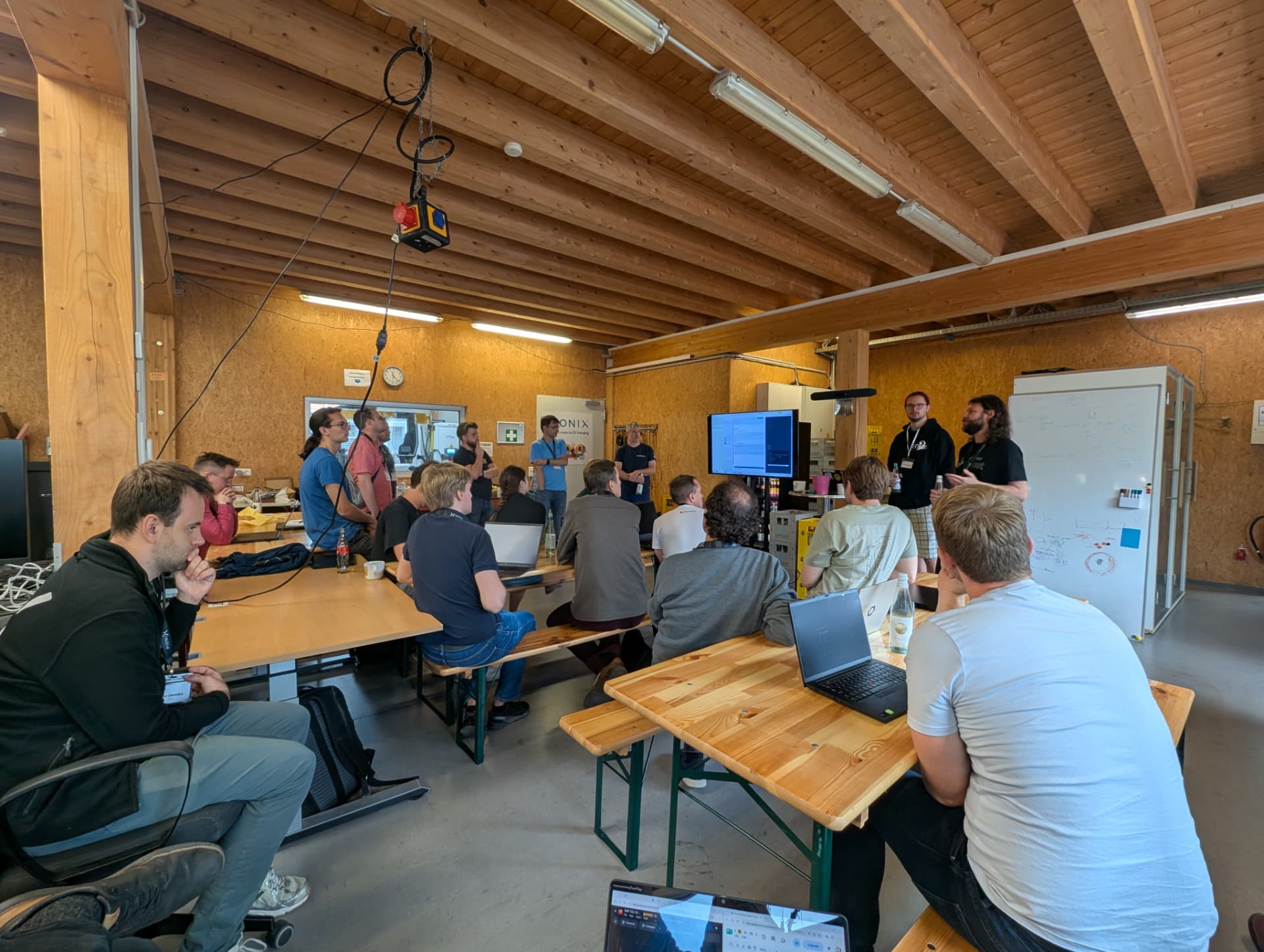 Hackathon participants gathered around a work table