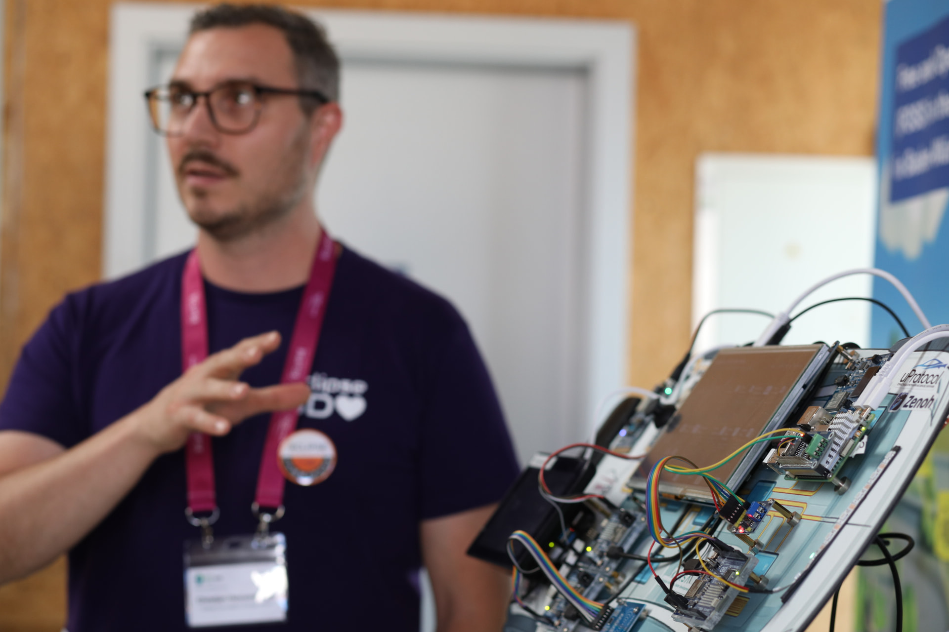 Speaker presenting a live hardware demo board