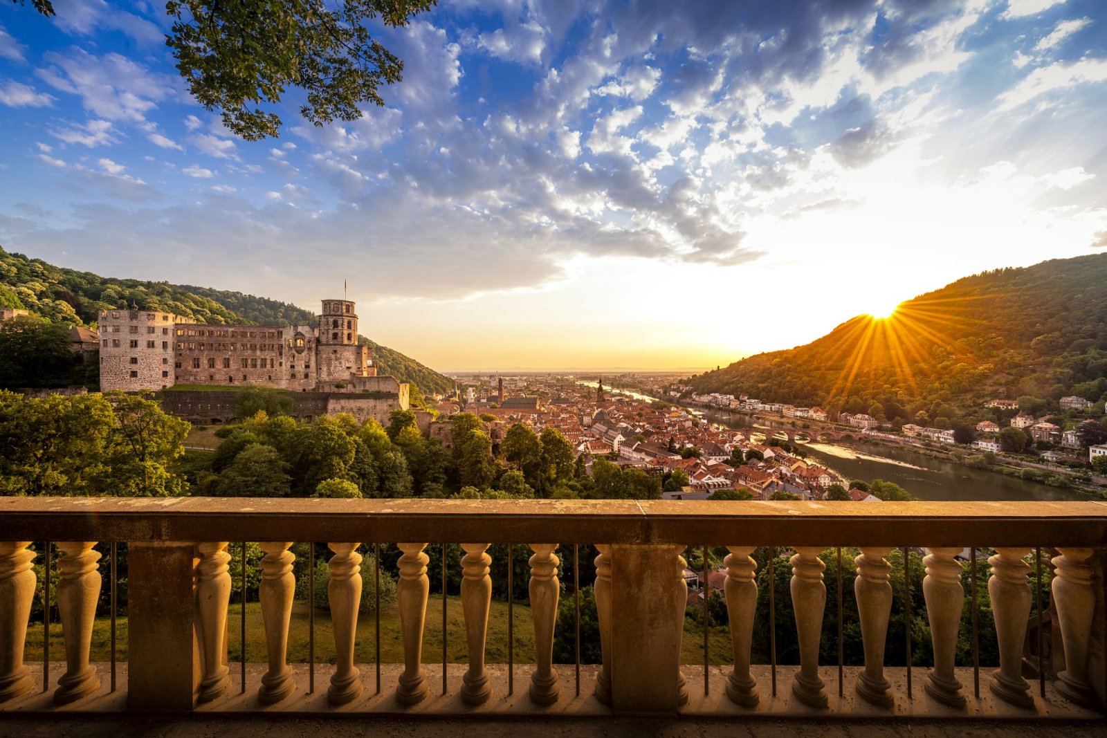 Heidelberg Castle and old town at sunset, viewed from the Philosophenweg